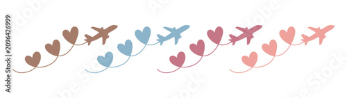 Photos Airplanes flying with heart-shaped trails for travel and romantic vacation desig