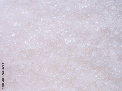 Konstfotografi Extreme macro of white granulated sugar crystals revealing their transparent crystalline texture