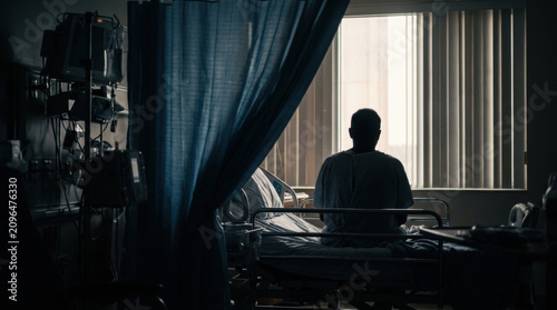 Solitary Patient Contemplates Hope Beside Hospital Window