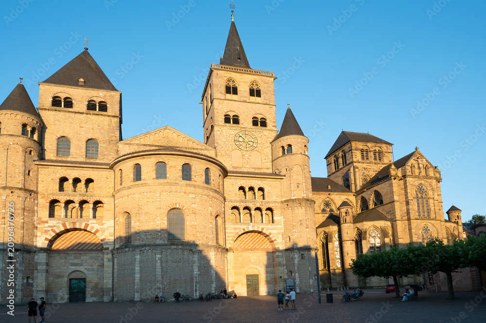 Fototapeta premium High Cathedral of Saint Peter in Trier, Moselle Valley Germany, roman catholic dom, brickwork tower facade 
