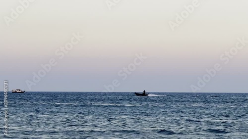 A boat sails on the sea. Cyprus Island, tourist boats, Mediterranean Sea.