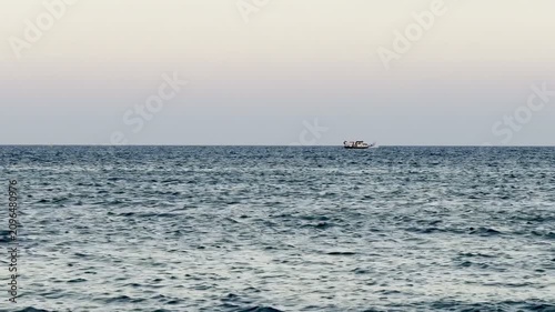 A boat sails on the sea. Cyprus Island, tourist boats, Mediterranean Sea.