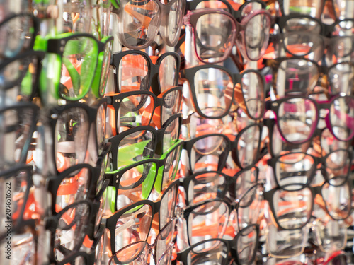 Canvas Print Showcase with glasses with diopters hang on a wall in several rows