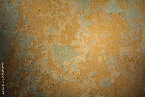 Photography Aged, peeling yellow and green paint creating a textured vintage surface