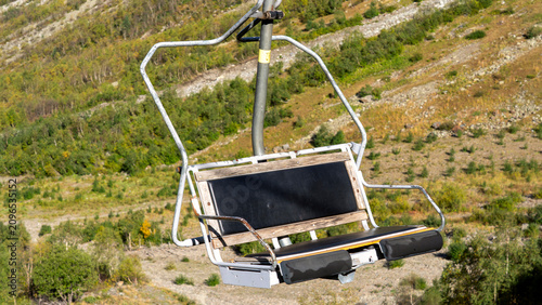 Canvas Print Broken ski chair lies on a mountain slope