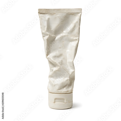 Squeezed Empty White Cosmetic Tube with Cap on White Background