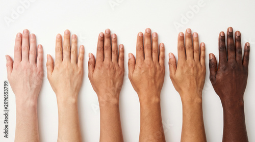 Diverse group of hands with different skin tones and ethnicities showing healthy skin, skin diversity inclusion multicultural healthcare concept