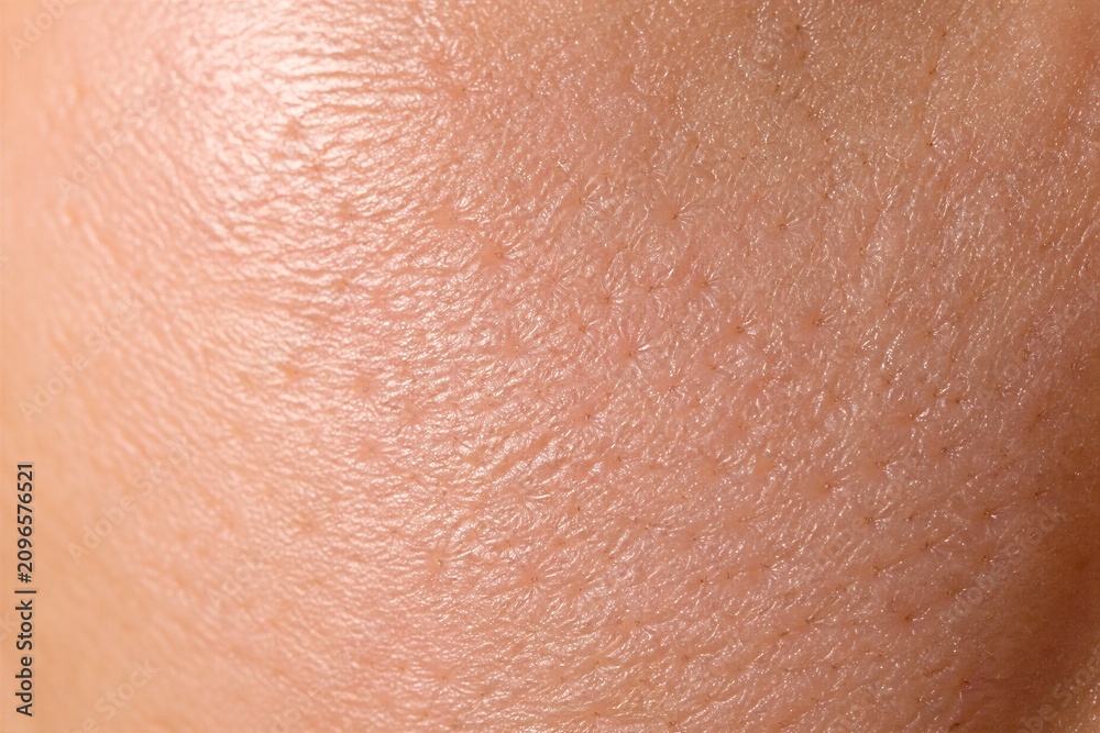 Fototapeta premium Closeup human skin texture showing pores and fine detail