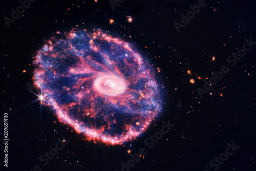 Vibrant cosmic nebula glows in deep space. Red and blue gases swirl amid countless stars. Elements of this image furnished by NASA
