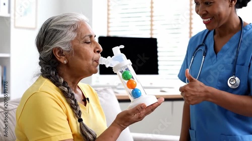 Newborn baby being held by a medical professional in a hospital delivery room