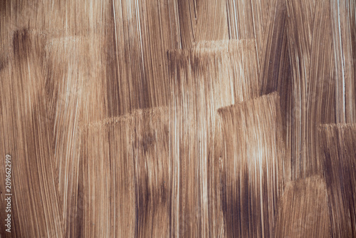 Photos Vintage brown painted wooden background with vertical abstract brushstroke texture
