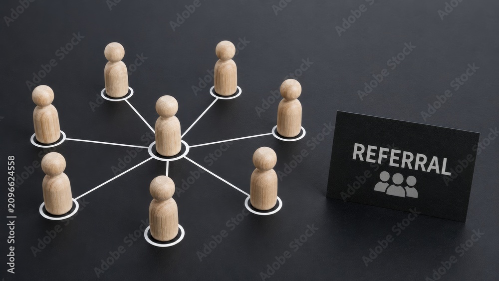 Obraz premium Referral Marketing Concept with Connected Wooden Figures Representing Business Network and Recommendations