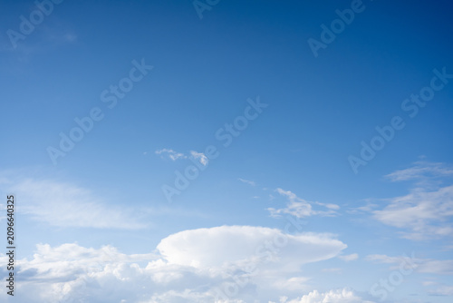 Vibrant blue sky fills the image
