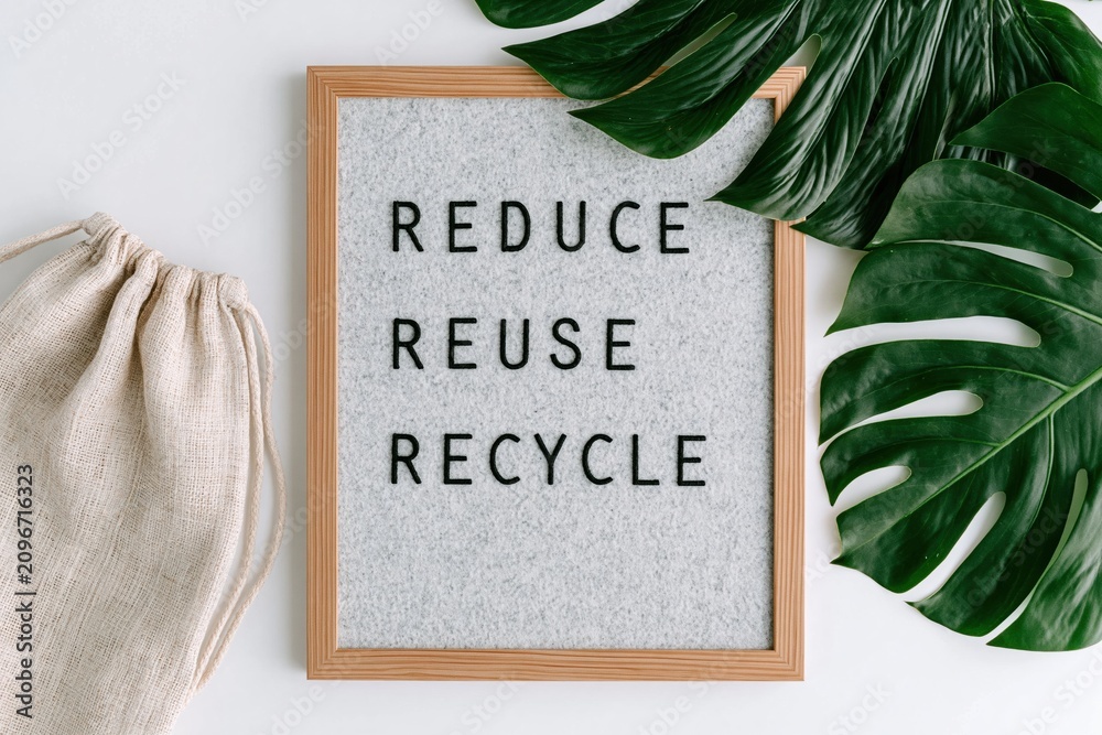 Fototapeta premium Sustainability and eco friendly concept with text Reduce Reuse Recycle and green nature leaves