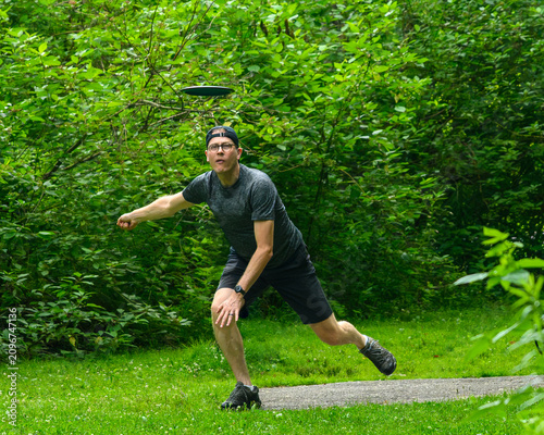 Disc Golfer Throws Toward Camera
