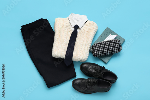 Quadro su tela School uniform with black trousers, white shirt, knitted vest, tie, and brogue s