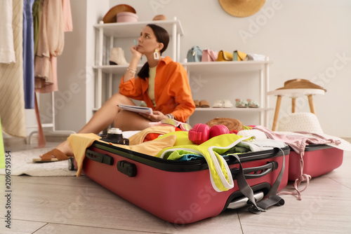 Young woman planning a trip...