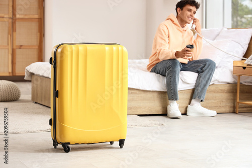 Yellow suitcase in a hotel ...