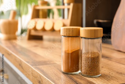 Two glass spice jars with b...