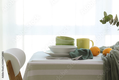 Dining table set with green...