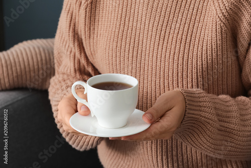 Woman in a cozy beige knitt...