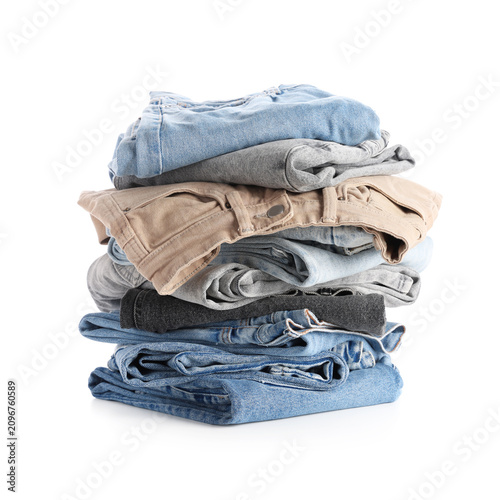 Foto Stack of folded denim jeans and pants in various colors, casual clothing and fas