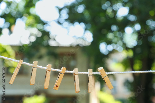 Wooden clothespins on a whi...