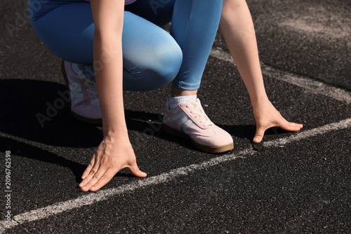 Female athlete in starting ...