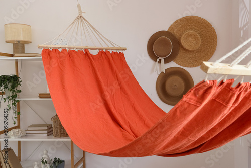 Orange fabric hammock hangi...