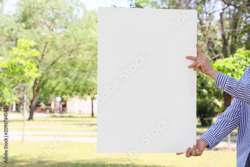 Person holding a blank whit...