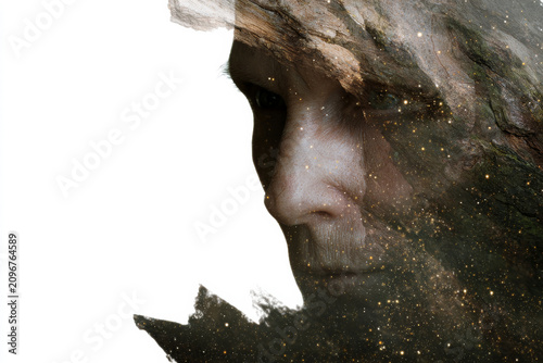 Minimal double exposure portrait of an old woman merged with tree bark textures for surreal background or poster design