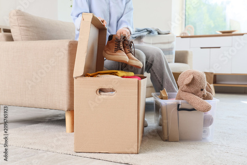 Person packing shoes into a...