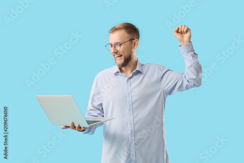 Excited young man with a be...