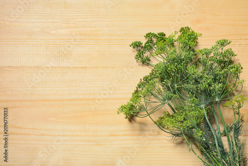 Bunch of fresh dill on wood...