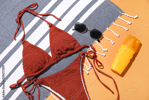 Stylish swimsuit, sunglasse...