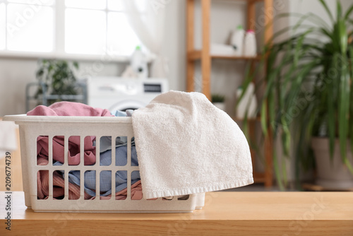 Basket with laundry on wood...