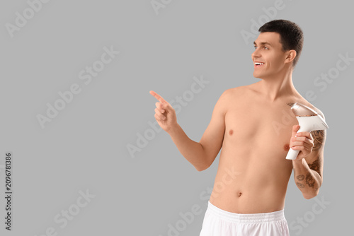 Young man with photoepilato...