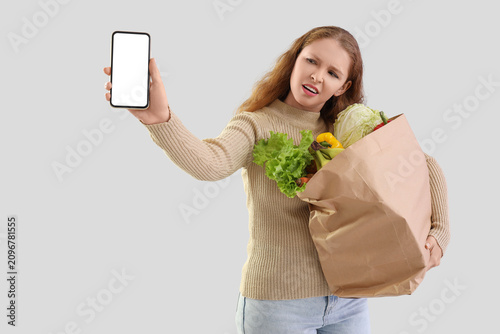 Displeased young woman with...