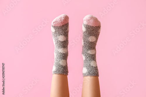 Legs of young woman in warm...