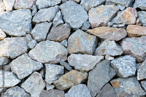Closeup of natural crushed stones rough gray surfaces irregular shapes creating durable rock texture background for construction landscaping design