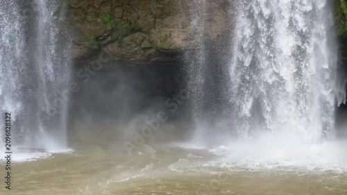 Close Up Powerful Waterfall Splashing with Water Mist and River Stream