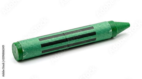 Single green wax crayon isolated on a clean white background