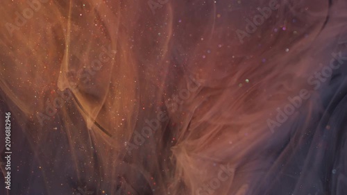 Ink drop splash. Mix fume texture. Blur purple pink yellow color broken glass glitter rainbow cloud spreading on abstract acrylic background.