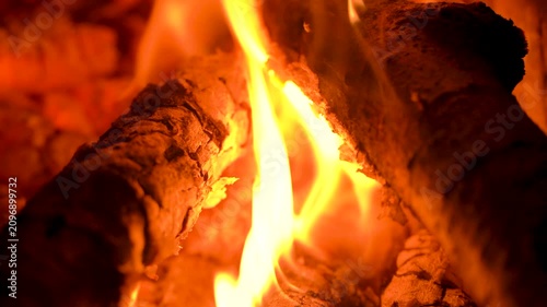 Close-up of Bright Orange Flames Burning on Wood Logs in Fireplace
