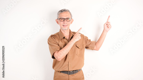 Bild auf Leinwand Civil worker man or teacher pointing up, explaining