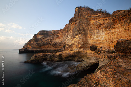 фотографія The quite waves hit the rocks in the blue sea at Tanjung Bloam beach, Lombok, In