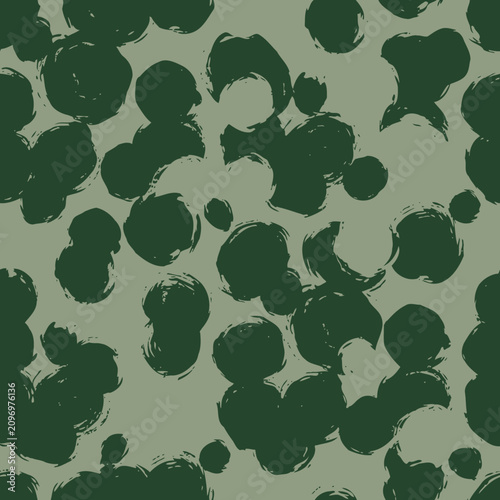 Abstract green brushstroke pattern on a muted gray background