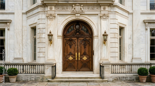 Ornate carved wooden double front doors of a historic mansion with entrance architecture historic