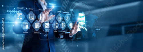 Corporate auditor touch virtual screen reviewing daily performance metrics and strategic growth charts. Comprehensive business review requiring a detailed Assessment of corporate structure.