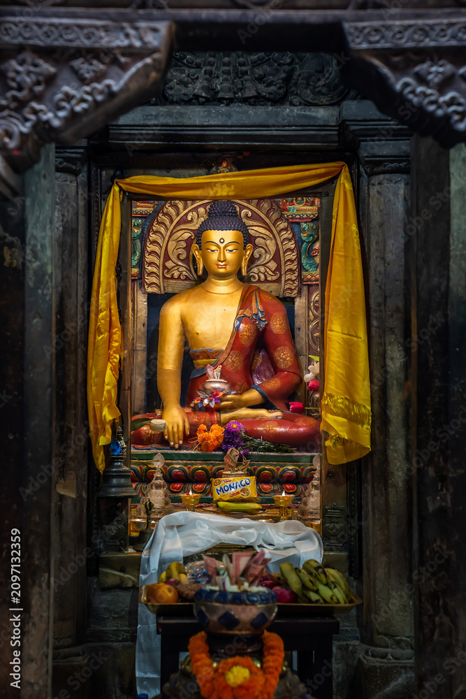 Fototapeta premium Buddha statue and an offering at it. Altar, or 
